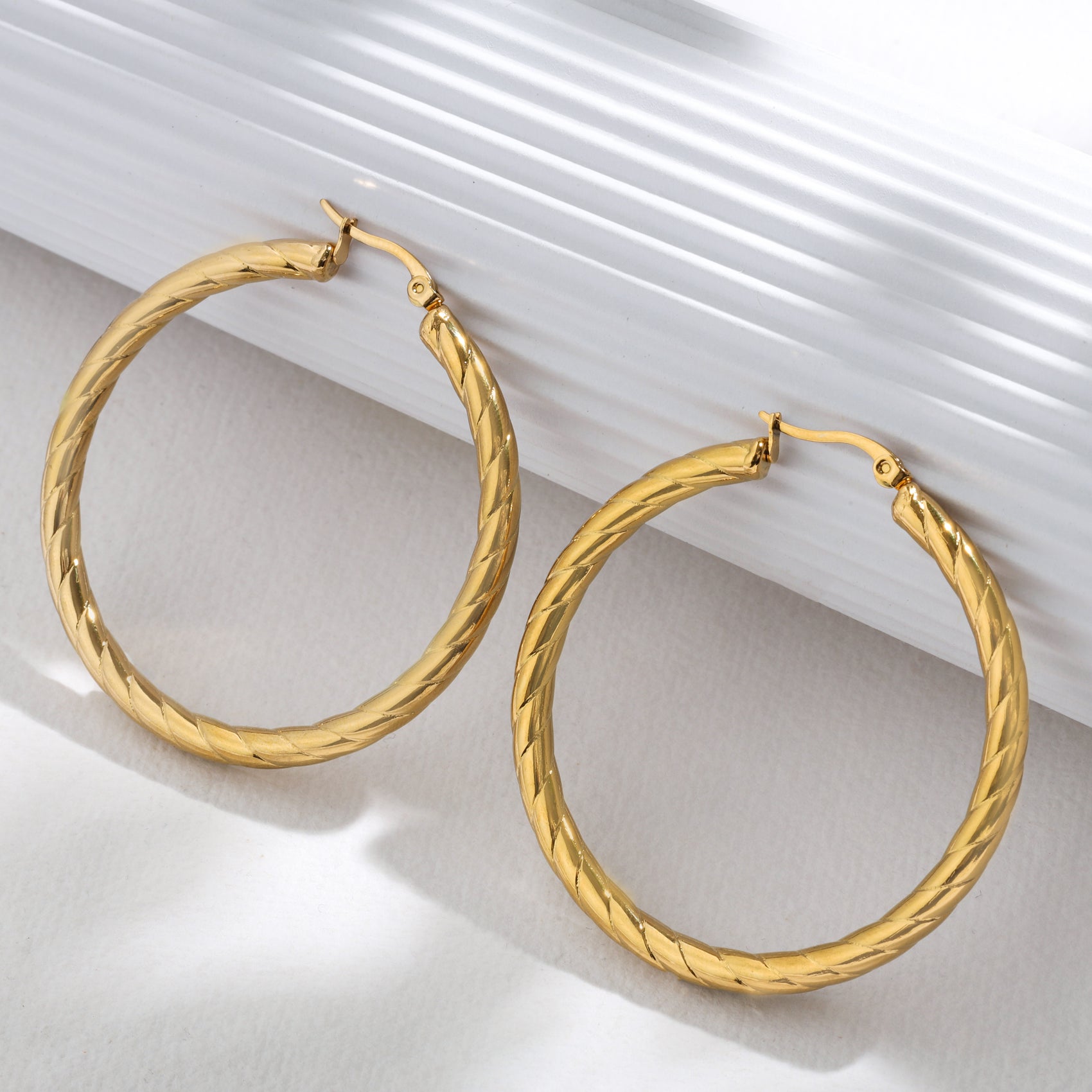The Sleek Spiral Hoops – 18K Gold-Plated Shine